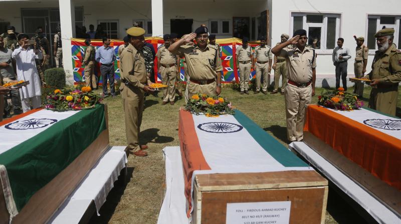 The three policemen were abducted from their homes in south Kashmirs Shopian district and shot dead in cold blood by the Hizbul Mujahideen. (Photo: PTI)