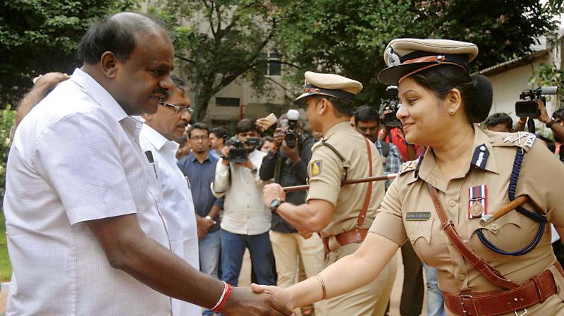 Senior Police officers welcome Chief Minister H.D. Kumaraswamy at DG and IGPs Office in Bengaluru on Friday   (Image: DC)