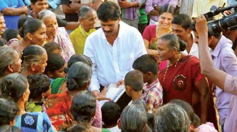 In this file photograph, Kundapura MLA Halady Srinivas Shetty campaigns during a previous election.