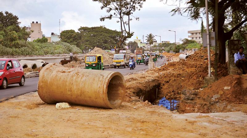 Motorists face the danger of falling into pits like this one near Okalipuram junction in Bengaluru (Photo: Shashidhar B)