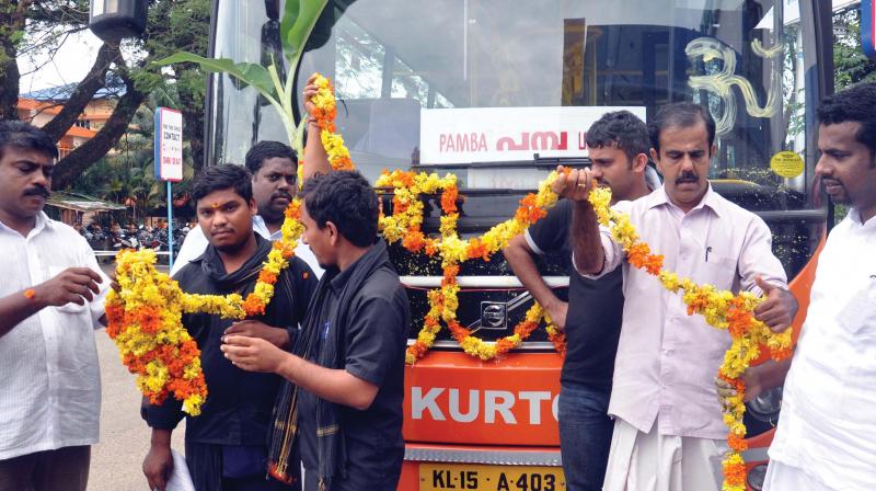 File photograph of a bus being flagged off to Pamba