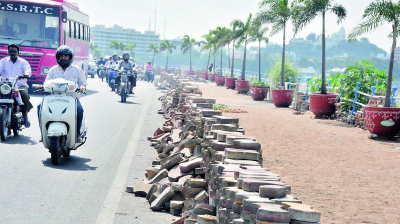 The pavements at Tank Bund being refurbished in view of Global Enterpreneurship Summit on Thursday. (Photo: DC)