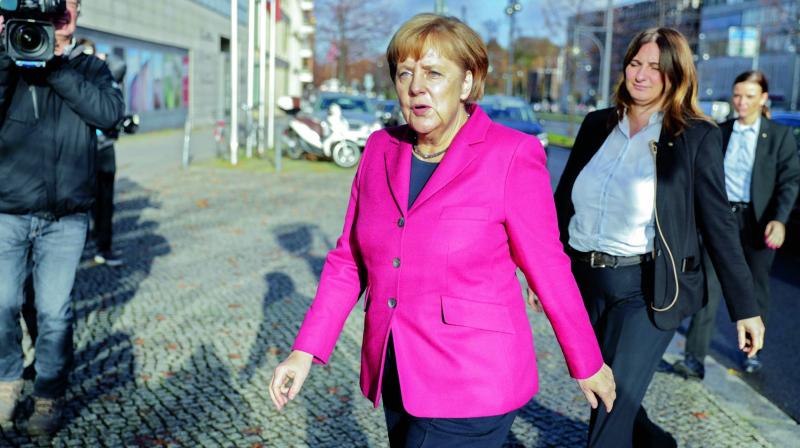 German Chancellor Angela Merkel arrives at the CDUs headquarters for further exploratory talks with members of potential coalition parties to form a new government in Berlin.( Photo: AFP)