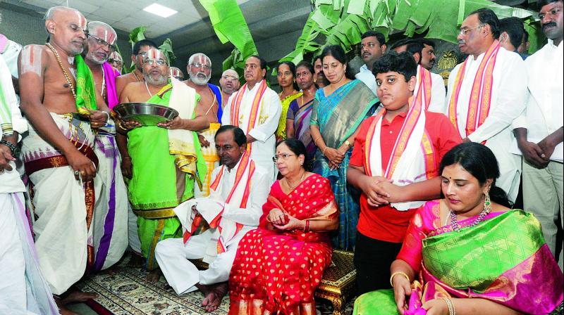 Chief Minister K. Chandrasekhar Rao, his wife Shobha, minister K.T. Rama Raos wife Shailima and their son Himanshu receive blessings from priests at the Lakshmi Narasimha Swamy temple at Yadadri on Friday.