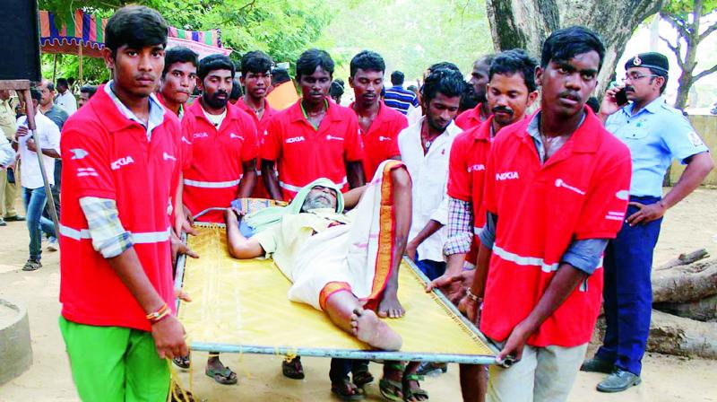 Central and state disaster management departments officials and volunteers in a mock tsunami exercise at Tupallipalem village in Vakadu mandal of Nellore district on Friday. (Photo: DC)