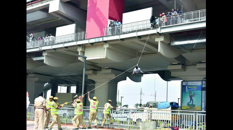 A fire drill and mock rescue operation under way at the Miyapur and Kukatpally stations on Saturday, ahead of  Prime Minister Narendra Modis visit  to inaugurate the first phase of Hyderabad Metro Rail. (Photo: Pawan)