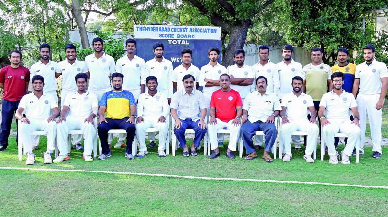 Members of the Hyderabad U-23 cricket team pose after qualifying for the all-India knockout quarterfinals of the Col C. K. Nayudu Trophy and thereby getting promoted to the Elite Division of the age group competition for next year.