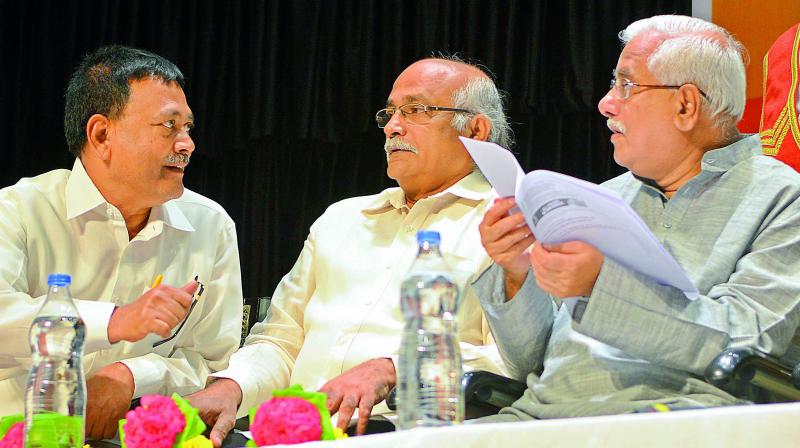 Former SC judge V. Gopala Gowda shares a word with Citu leader M.A. Gafoor at a programme held marking the Constitution Day in Vijayawada on Sunday.