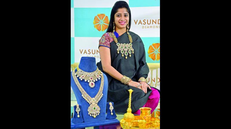 A model displays diamond jewellery at the showroom in Vijayawada on Sunday.