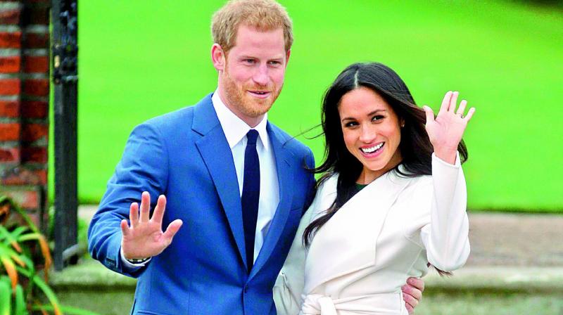 Britains Prince Harry and his fianc©e Meghan Markle at the Sunken Garden.