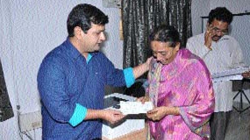 The collector gave away cheques to the kin on the victims of the recent boat tragedy in Vijayawada. 	 (Photo: DC)