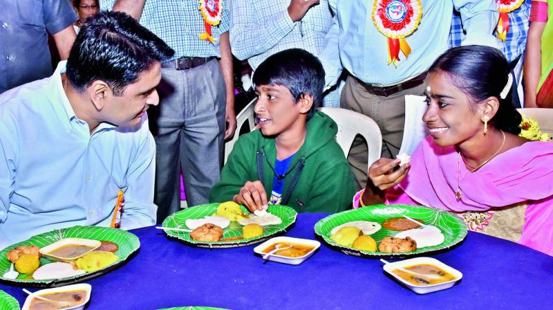 East Godavari District Collector Karthikeya Mishra with children suffering from HIV on the occasion of World AIDS Day at his camp office in Kakinada on Friday. (Photo: DC)