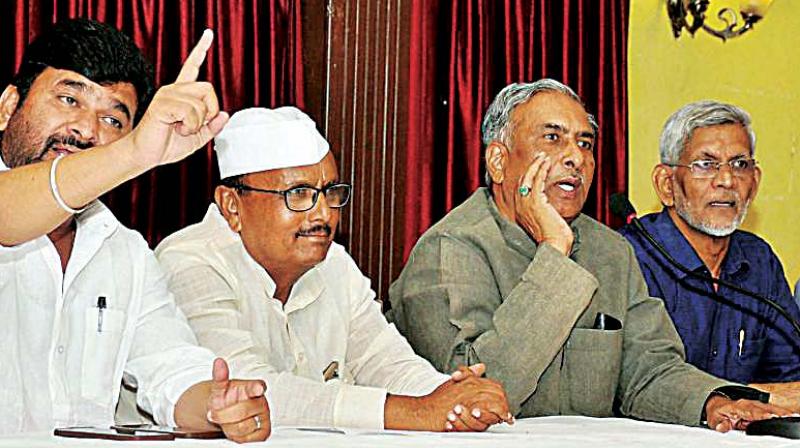 A file photo of Minister Vinay Kulkarni with Lingayat leaders B.R. Patil, Basavaraj Horatti and S.M. Jamdar
