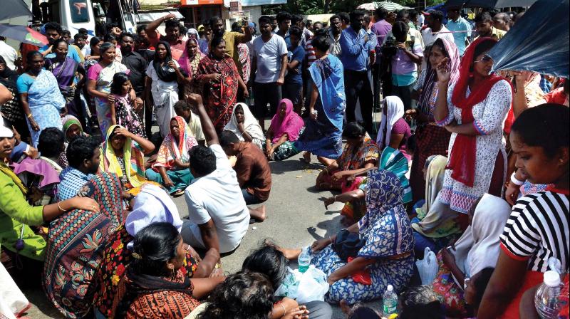 Families of the missing fishermen block Chacka junction in protest against the government apathy in saving the lives of their kin. ( Photos: Peethambaran Payyeri)