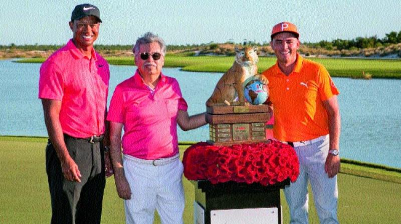 Tiger Woods (from left) and Hero MotoCorp CMD Pawan Munjal pose with the winner of the Hero World Challenge Rickie Fowler in Albany on Sunday.