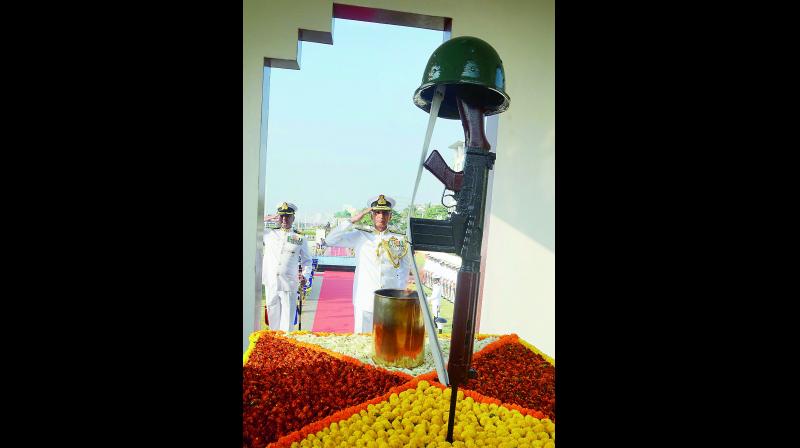 Commander-in-Chief of Eastern Naval Command, Vice-Admiral Karambir Singh pays tributes at the Navy War Memorial, Victory at Sea, during the Navy Day celebrations in Visakhapatnam on Monday. (Photo: K. Muralikrishna)