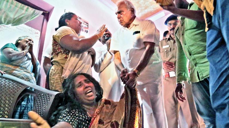 TN Governor Banwarilal Purohit consoles wife of the dead fisherman, John Davidson at Colachel on Thursday. (Photo: DC)