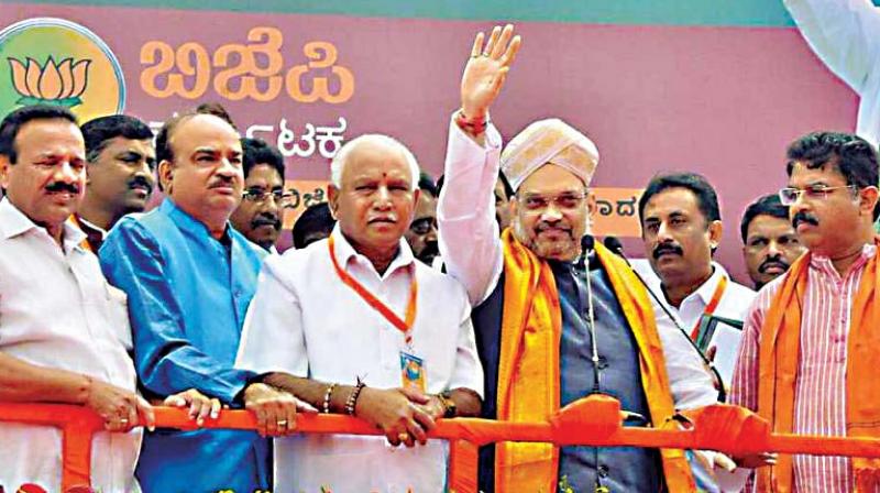 State BJP core committee members with party president Amit Shah during his recent visit to Bengaluru (Photo:  DC)
