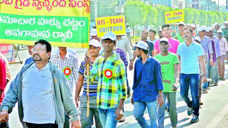 Gareeb Guide voluntary organisation activists take out an awareness rally on RTI Act on Bandar road in Vijayawada on Sunday. (Photo: DC)