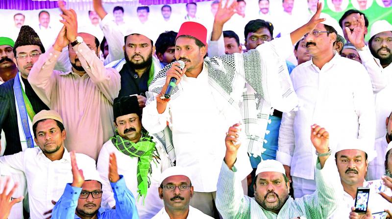 YSRC chief Y.S. Jagan Mohan Reddy interacts with minorities at Mudigubba on Monday.