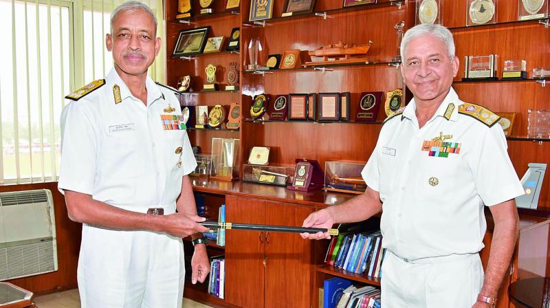 Vice-Admiral M.S. Pawar (left) assumes the charge as Chief of Staff, Eastern Naval Command, from outgoing Vice-Admiral Atul Kumar Jain (right) at ENC in Visakhapatnam on Monday.