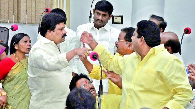 The TD and YSRC corporators argue with each other at the council meeting in Vijayawada on Wednesday. (Photo: DC)