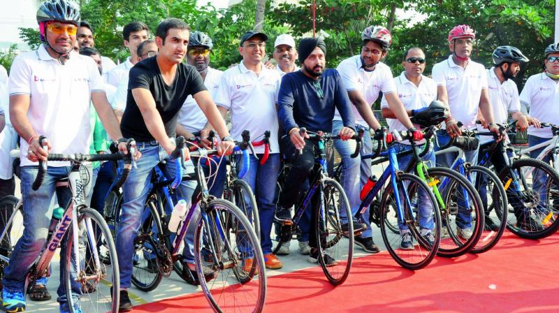 Cricketer Gautam Gambhir joins the cyclists from alumni of IIM Ahmedabad during the concluding ceremony of 1000 km Umeed Cycle Rally at Satya Sai Vidya Vihar School in Visakhapatnam on Friday.  (Photo: DC)