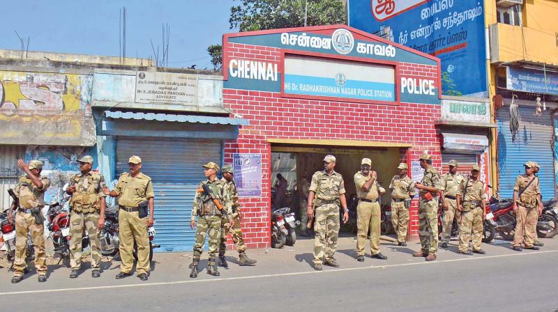 Paramilitary forces deployed near RK Nagar police station after tension prevailed following the apprehension of a woman for allegedly distributing money on Sunday. (Photo: DC)