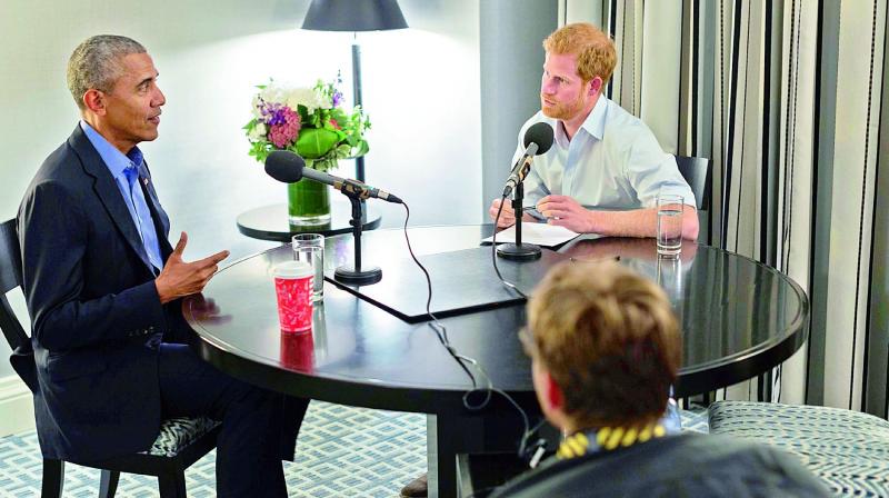 Britains Prince Harry, right, interviews former US President Barack Obama as part of his guest editorship of BBC Radio 4s Today programme. (Photo: AFP)