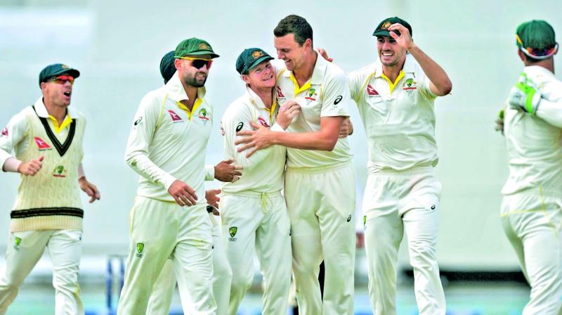 Australian players celebrate a wicket during the third Ashes Test against England at Perth on Monday. (Photo:  AP)