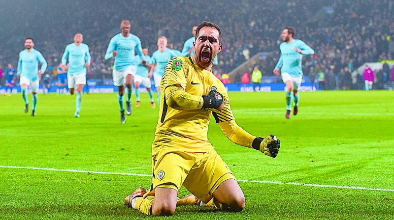 Manchester Citys Claudio Bravo celebrates after winning their English League Cup quarterfinal against Leicester City at the King Power Stadium in Leicester on Wednesday. City won 4-3 on penalties	(Photo: AFP)