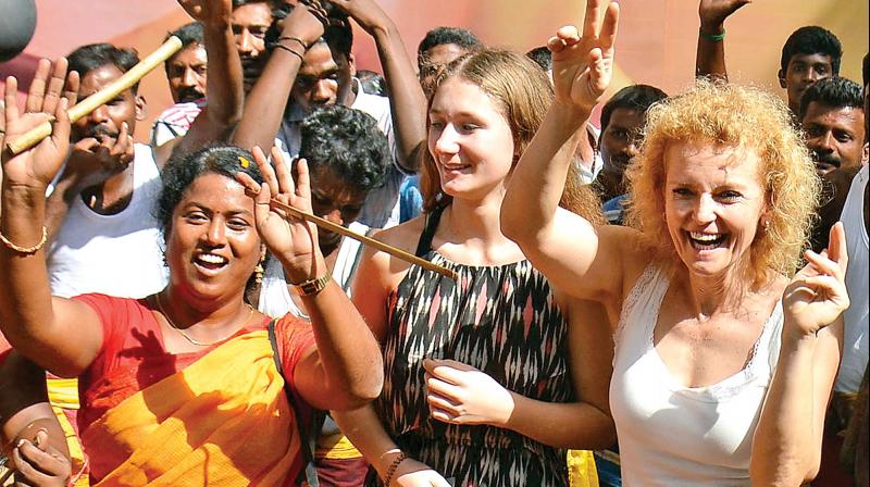 Foreigners too join the Saturday revelry near the Gopalapuram residence of DMK chief M. Karunanidhi  during a rousing reception organised by DMK members. (Photo: DC)