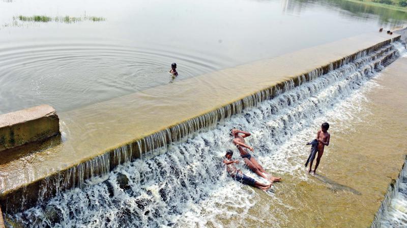 Water overflows from a lake in Thiruvallur after good rainfall received this Northeast monsoon. (Photo: DC)