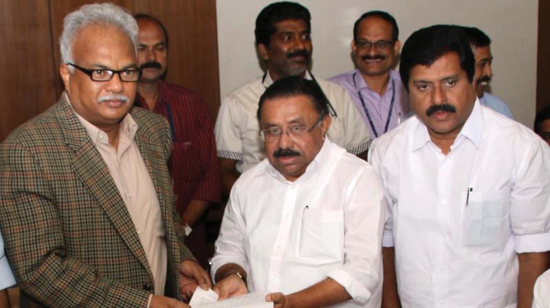 The chief of Central team for Ockhi disaster relief, Bipin Mallick, gets a set of demands from UDF, headed by KPCC president M.M. Hassan, in Thiruvananthapuram on Wednesday. V. S. Sivakumar, MLA is also seen.  (Photo: G.G. Abhijith)