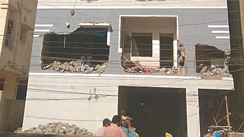 A building under construction after being demolished by GHMC staff at Gokul Plots in Hafezpet on Thursaday.