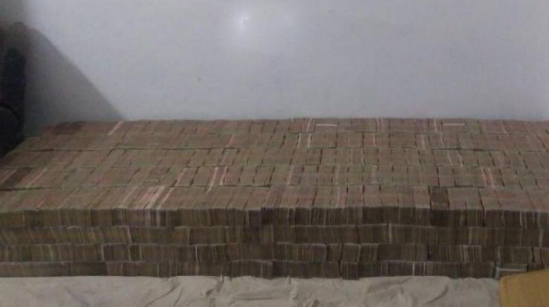 Uttar Pradesh Police on Wednesday seized demonetised currency notes estimated to be worth Rs 100 crore in Kanpur. (Photo: ANI)