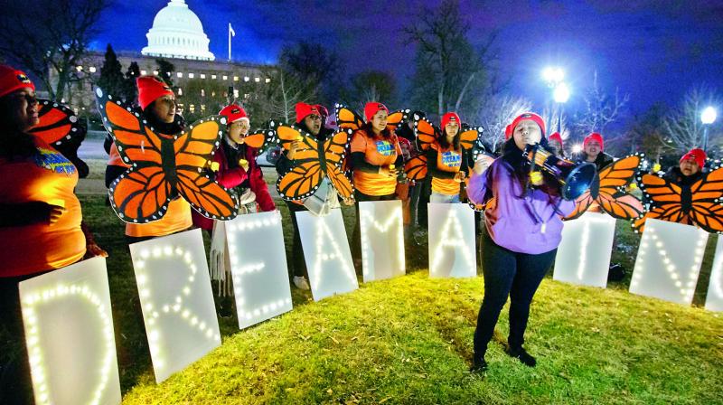 Demonstrators chant in support of Deferred Action for Childhood Arrivals during a rally outside the Capitol, in Washington, on Monday.  (Photo:AFP)