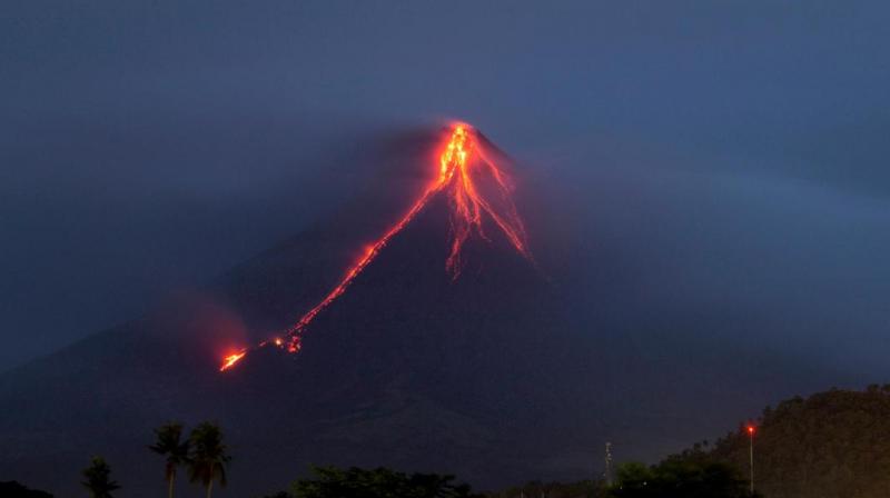 The eruptions have shrouded nearby villages in darkness and sent lava, rocks and debris cascading down Mayons slopes toward the no-entry danger zone.(Photo: AP)