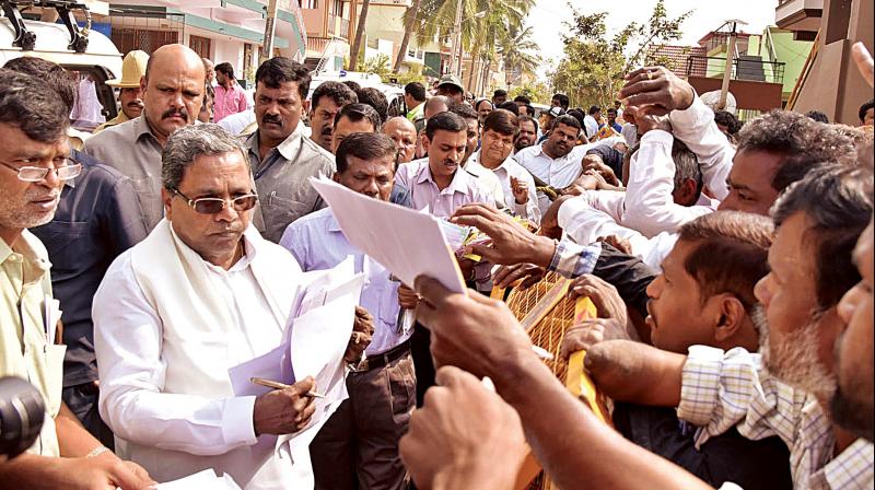 Chief Minister Siddaramaiah listens to the grievances of the public at his residence in Mysuru on Wednesday
