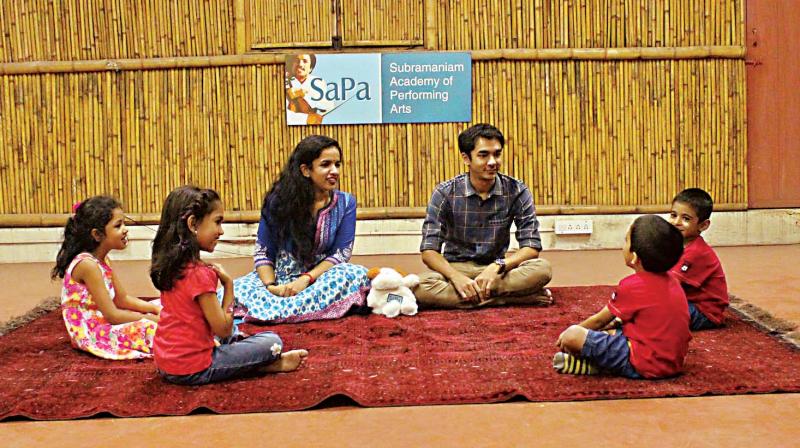 Siblings Bindu Subramanium (Left) and Ambi Subramanium teaching music to kids in the city