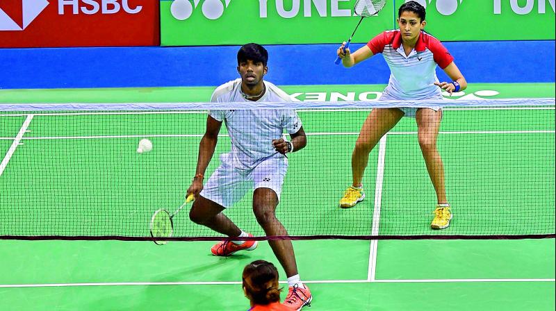 Indians Rankireddy Satwiksairaj and Ashwini Ponnappa in action during their mixed doubles second round match against Malaysias Tan Kian Meng and Lai Pei Jing at the India Open at Siri Fort Indoor Stadium in New Delhi on Thursday. Satwik-Ashwini won 21-16, 15-21, 23-21. (Photo:PTI)
