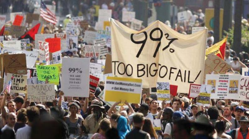 A file photo of people demonstrating against government policies that favour one per cent rich.