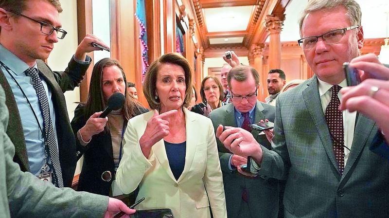US House Minority Leader Nancy Pelosi speaks to the media after her speech which lasted for more than eight hours. (Photo:AFP)