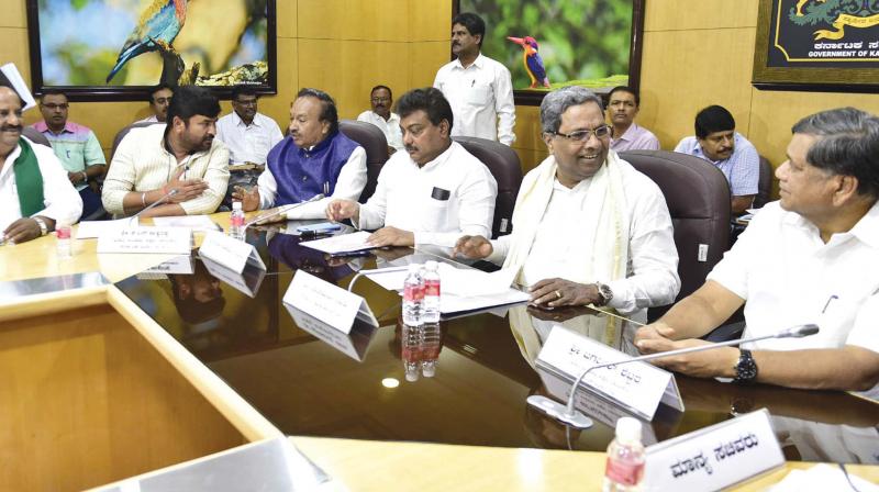 Chief Minister Siddaramaiah, water resources minister M.B. Patil and BJP leaders Jagadish Shettar and K.S. Eshwarappa at a meeting on the Mahadayi tribunal in Bengaluru on Thursday