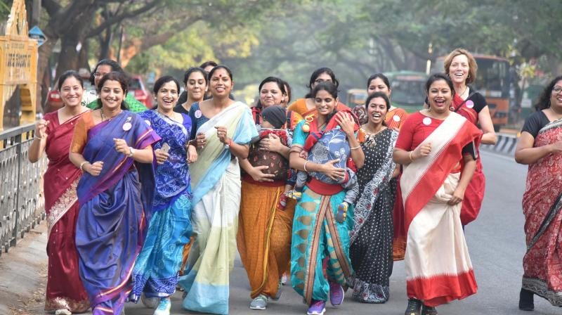 Women taking part in the Saree Run to raise awareness about breast cancer in Bengaluru on Sunday. (Photo:DC)