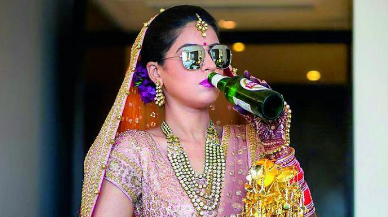 A bride glugs beer in this photograph used for representative purposes only