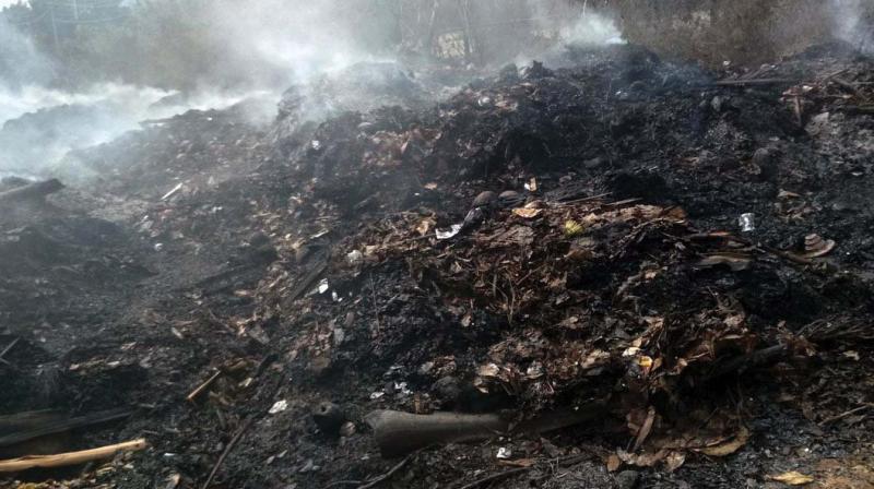 Garbage being burnt Rajiv Gandhi Nagar in Kodigehalli.