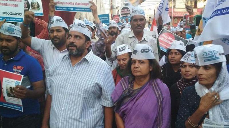 Prithvi Reddy, State Convener, AAP Karnataka participates in a protest march organised by the party, condemning the hgooliganism of Nalapad