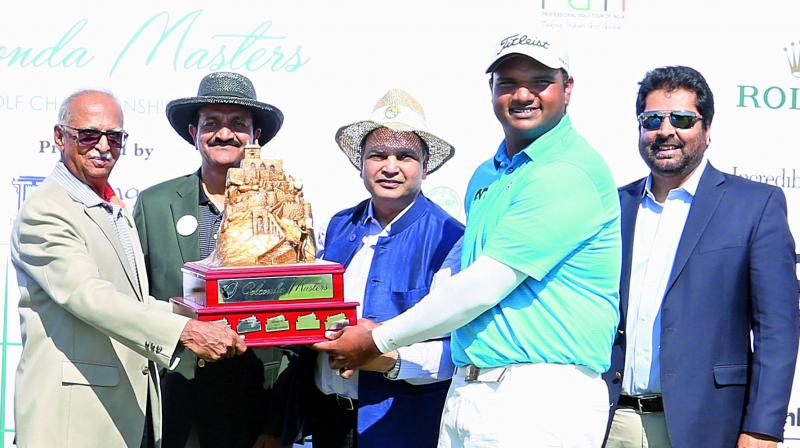 Udayan Mane (right) receives the winners trophy from Hyderabad Golf Association president J. Vikramdev Rao (from left), HGA captain C. Dayakar Reddy and Telangana government chief secretary Shailendra Kumar Joshi at the HGA club in Hyderabad on Sunday.