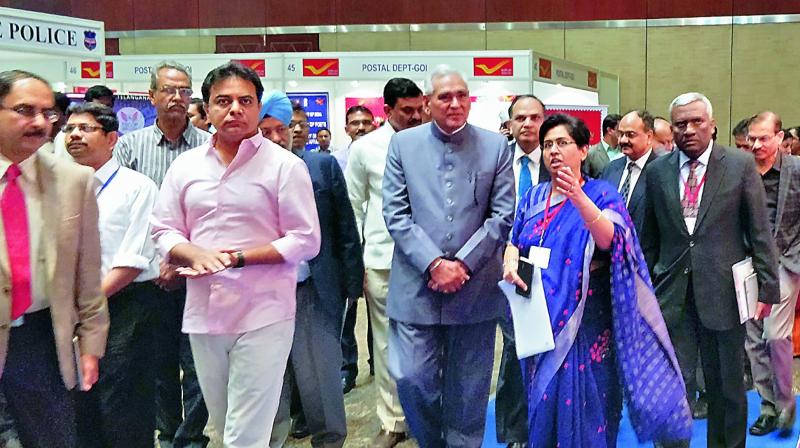 Minister K.T. Rama Rao along with senior IAS officer Shailender Kumar Joshi and other officials takes a look at the Hall of Fame put up at the National e-governance conference being held at HICC on Monday.